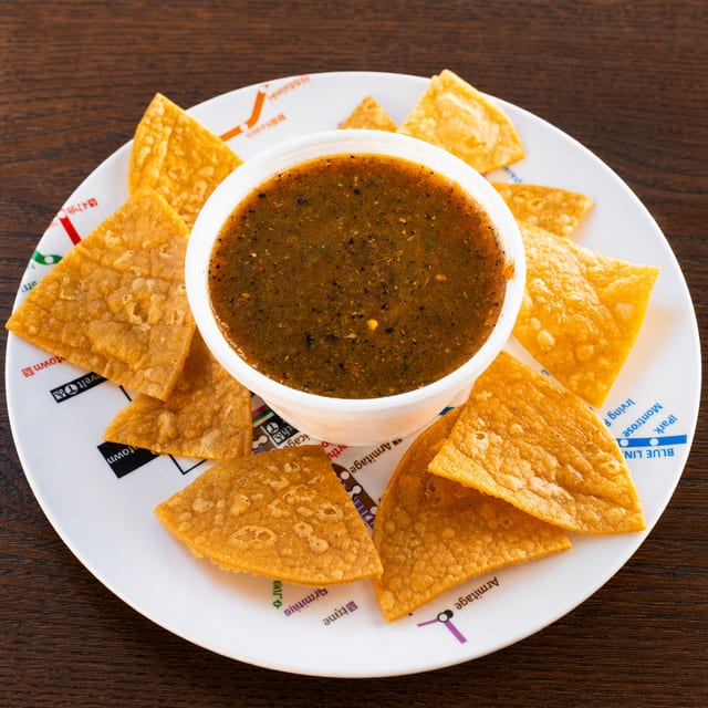 House Roasted Red Salsa & Hand-Cut Chips.